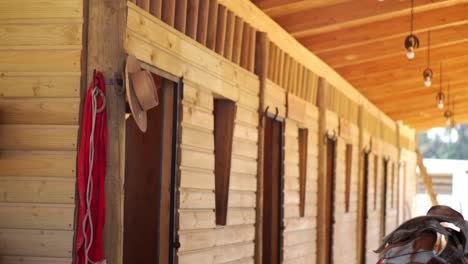 Cowboy-Hat-Hanging-In-A-Doorway-Of-A-Horse-Barn