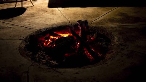 A-hyper-lapse-of-a-large-evening-campfire-burning-through-wood-on-a-beautiful-evening-in-the-African-bushveld,-South-Africa