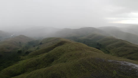 Aerial-View-Of-Mountain-Range-Covered-With-Fog