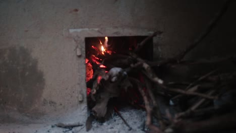 Zoom-in-shot-of-burning-woods-at-traditional-Indian-stove