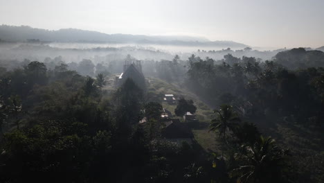 Village-And-Forest-Shrouded-By-Fog-In-The-Morning-In-Sumba-Island,-Indonesia