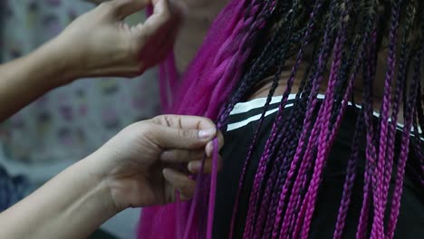 Fast-and-Skillful-Hair-Braiding-of-Colorful-Hair,-Hair-Plaiting-Lacing-Interlacing,-Purple-Black-Gothic-Braid-Hair-Style