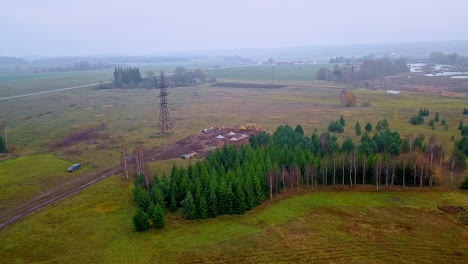 Verdant-Coniferous-Trees-Near-The-Construction-Site-Of-Transmission-Tower-In-The-Countryside
