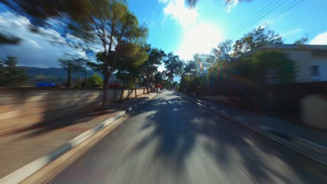 POV-footage-of-a-wooded-village-road