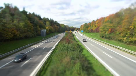 Cars-driving-fast-over-a-German-highway-in-"tilt-shift"-effect