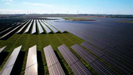 Sunlight-Reflected-in-Solar-Panels-Farm-in-Poland---Aerial-Ascending