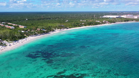 aerial-panoramic-of-vibrant-turquoise-blue-Caribbean-ocean-at-Playa-Xpu-Ha-Mexico-on-sunny-summer-day