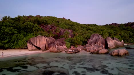 Seychelles-Beach-with-Boulders-and-palm-trees-at-sunset-Anse-Source-D'argent