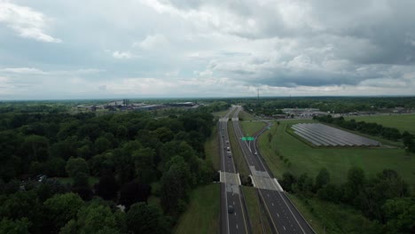 Overtake-Shot-Of-Solar-Panels-Roadside-On-Green-Field-,-Ohio-United-States