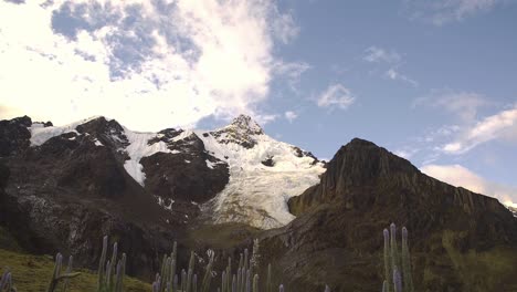 Tilting-up-to-the-breath-taking-visuals-of-the-snowcapped-peaks-of-Peruvian-Andes-in-Huaraz-with-amazing-sky-in-the-Ancash-region