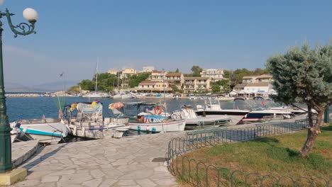 Row-Of-Picturesque-Traditional-Fishing-Boats-Moored-Together-At-Kassiopi-Village
