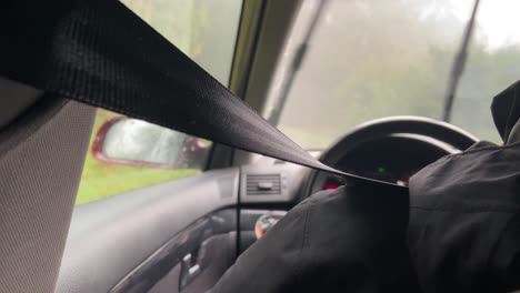 View-Behind-Person-Driving-Car-in-Rainy-day-With-Wind-Screen-Wipers-On