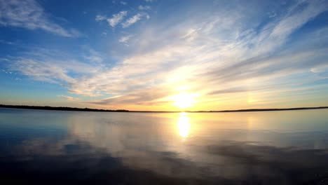 Beautiful-sunrise-in-the-morning-at-calm-lake-scenery