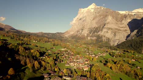 aerial-drone-footage-dolly-left-to-right-over-Grindelwald-in-front-of-Wetterhorn-mountain