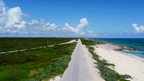 aerial-landscape-of-long-coastline-road-in-Cozumel-Mexico-on-sunny-summer-day