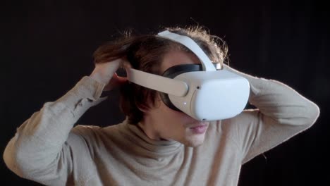 A-young-man-puts-on-a-VR-Headset