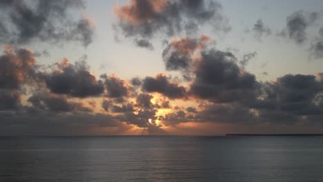 Indian-Ocean-sunset-near-Uroa-beach-in-Zanzibar-Island,-Tanzania-Africa,-Aerial-pan-left-shot