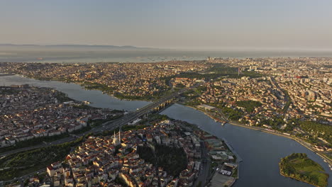 Istanbul-Turkey-Aerial-v36-flyover-beyoğlu-towards-eyüpsultan-capturing-busy-traffic-on-haliç-bridge-across-golden-horn-and-vast-expanse-of-marmara-sea-at-sunrise---Shot-with-Mavic-3-Cine---July-2022