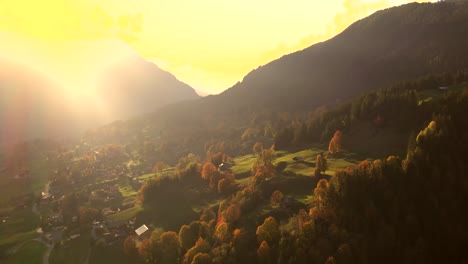 aerial-drone-footage-rising-up-with-sunset-view-of-Grindelwald-valley