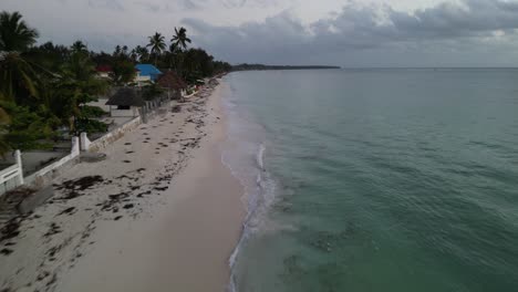 Beach-home-properties-in-Uroa-Beach-Zanzibar-Island,-Tanzania-Africa,-Aerial-forward-shot