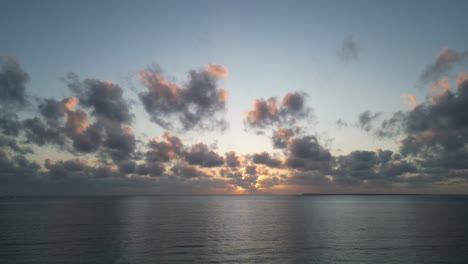 Sunset-in-the-Indian-Ocean-at-Uroa-beach-in-Zanzibar-Island,-Tanzania-Africa,-Aerial-flyover-shot
