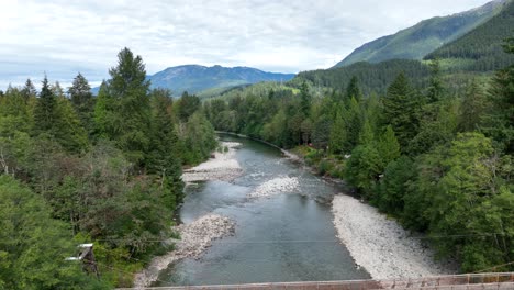 Drone-view-of-the-Skykomish-River-with-the-Baring-Bridge-spanning-the-distance