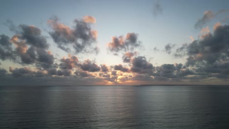 Indian-Ocean-sunset-from-Uroa-beach-in-Zanzibar-Island,-Tanzania-Africa,-Aerial-hovering-shot