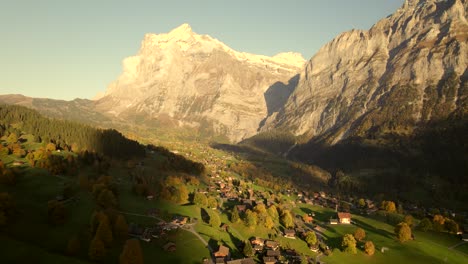 aerial-drone-footage-pushing-out-over-Grindelwald-in-the-Swiss-Alps,-autumn