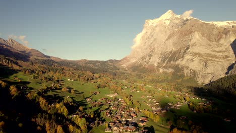 aerial-drone-footage-pushing-in-over-Grindelwald-village-in-direction-of-Wetterhorn-mountain
