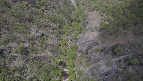 Drone-Flight-Over-Landscape-At-Emerald-Creek-Falls-In-Mareeba,-Australia