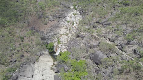 Aerial-View-Over-Emerald-Creek-Falls-In-Mareeba,-Australia-During-Summer---drone-shot