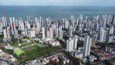 Overhead-Shot-Of-Recife-Skyscrapers-panning-to-international-City-Airport