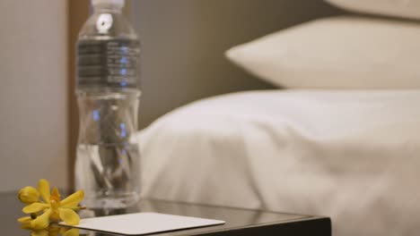 grab-a-glass-of-water-to-drink-in-the-bed-room-in-hotel-resort-relaxing-time