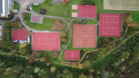 Aerial-Top-Down-View-Of-Empty-Red-Sports-Courts