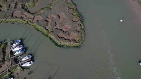 Shipwrecked-Boats-in-Blackwater-River-near-Tollesbury-Marina,-Essex,-UK---Aerial