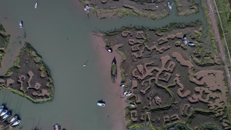 Overhead-View-Of-Ruined-Ship-Abandoned-On-Wetlands-In-Tollesbury-Marina,-Essex,-England-UK