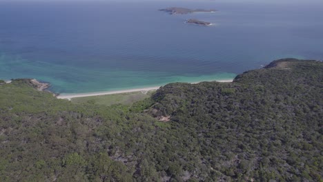 Aerial-View-Of-White-Sandy-Beach-At-Clam-Bay-In-Great-Keppel-Island,-Queensland,-Australia---drone-shot