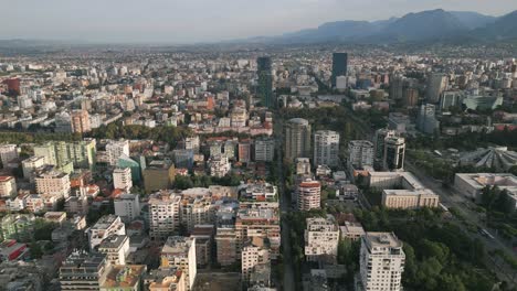Aerial-shot-of-Tirana-moving-in-on-Skanderbeg-Square-during-sunrise