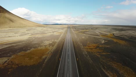Man-Running-On-Straight-Road-Drone-Shot,-Loneliness,-Freedom,-Adventure