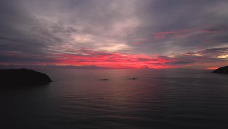 Dolly-shot-of-the-vibrant-sunset-setting-over-Pentai-Tengah-Beach,-Malaysia