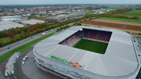 Orbit-Aerial-view-of-WWK-arena,-the-official-football-stadium-of-FC-Augsburg-in-Germany