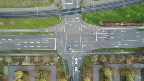 Aerial-Top-Down-View-Cars-Turning-Left-At-Intersection-In-Augsburg