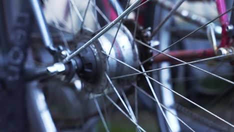 Slow-motion-camera-pan-over-a-wet-oldschool-locked-bicycle