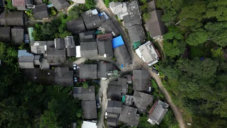 Overhead-drone-flight-looking-down-at-traditional-wooden-houses-in-Thailand
