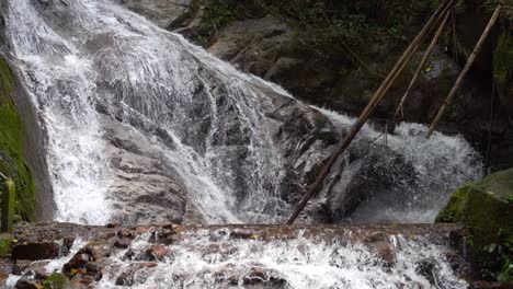 Stunning-waterfall-cascades-in-jugnle,-medium-locked-off-shot