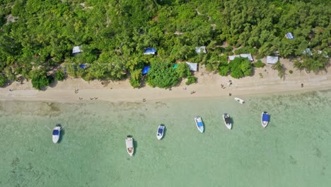 Birds-Eye-Aerial-View-of-Sandy-Coastline-of-Mauritius,-Anchored-Boats-and-Landscape-of-Ile-Aux-Benetier-Island-Beach,-Drone-Shot