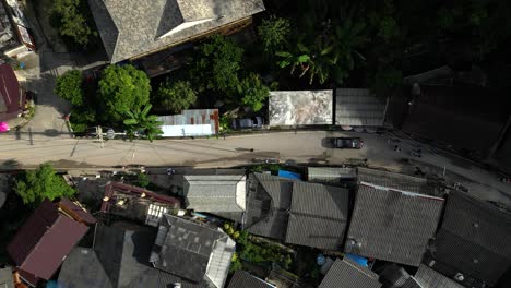 Looking-down-at-road-flanked-by-old-wooden-houses-in-Thai-mountain-village
