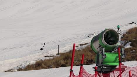 Snow-Making-Machine-on-side-of-a-ski-slope,-artificial-snow