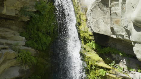 Descending-shot-of-waterfall-located-in-Santa-Paula-Punch-Bowls-Southern-California