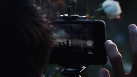 Slow-motion-video---close-up-shot-of-a-man-wear-black-mask-is-taking-picture-using-a-smartphone
